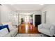 Spacious living room with hardwood floors, neutral walls, plants, and ample natural light at 6176 Kingsley Dr, Indianapolis, IN 46220
