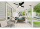 Relaxing screened-in porch featuring a porch swing and ample seating at 6176 Kingsley Dr, Indianapolis, IN 46220