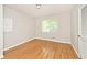 Bright bedroom featuring hardwood floors and a closet at 6248 Graham Rd, Indianapolis, IN 46220
