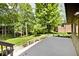 Spacious deck overlooking a lush green backyard with mature trees, providing a peaceful outdoor retreat at 6248 Graham Rd, Indianapolis, IN 46220