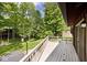 Outdoor deck overlooking a lush, green yard with mature trees, creating a serene and inviting outdoor space at 6248 Graham Rd, Indianapolis, IN 46220