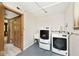 Functional laundry room with modern washer and dryer units at 6248 Graham Rd, Indianapolis, IN 46220