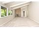 Bright living room featuring a stone fireplace, vaulted ceilings, and large windows with outdoor views at 6248 Graham Rd, Indianapolis, IN 46220