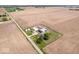 An aerial view of a sprawling farm including a house, various outbuildings, fields, and silos at 671 W 350 N, Shelbyville, IN 46176