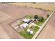 Aerial view of a farm property with main house, barns, outbuildings, vehicles, surrounded by fields at 671 W 350 N, Shelbyville, IN 46176