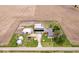 Drone's-eye view shows a farm property featuring a main house, barn, outbuildings, and surrounding fields at 671 W 350 N, Shelbyville, IN 46176