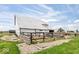 Exterior shot of a barn and surrounding gravel and lawn areas on a farm on a sunny day with blue skies at 671 W 350 N, Shelbyville, IN 46176
