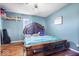 Bright bedroom featuring wood floors and a spacious bed at 671 W 350 N, Shelbyville, IN 46176
