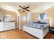 Cozy bedroom featuring natural wood paneling and ceiling fan at 671 W 350 N, Shelbyville, IN 46176