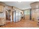 Spacious kitchen featuring stainless steel appliances, stone backsplash and wood floors at 671 W 350 N, Shelbyville, IN 46176