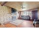 Inviting living room featuring a stone fireplace, hardwood floors, and natural light from the window at 671 W 350 N, Shelbyville, IN 46176