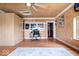 Bright office space with wood paneled walls, hardwood floors, and a functional workspace with desk and chair at 671 W 350 N, Shelbyville, IN 46176