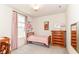 Cozy ' bedroom featuring a single bed, dresser, and playful decor, perfect for a retreat at 6832 Oakcrest Dr, McCordsville, IN 46055