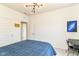 Well lit bedroom with modern light fixture, blue galaxy art and a fun 'May Yell At Video Games' sign at 6832 Oakcrest Dr, McCordsville, IN 46055