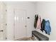 Inviting entryway with coat hooks, a bench, and a convenient space for organizing outdoor essentials at 6832 Oakcrest Dr, McCordsville, IN 46055
