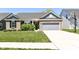 Charming brick home featuring a two-car garage, well-manicured lawn, and inviting curb appeal at 6832 Oakcrest Dr, McCordsville, IN 46055