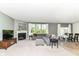 Open living space with a fireplace, comfortable seating, and seamless transition to the dining area at 6832 Oakcrest Dr, McCordsville, IN 46055
