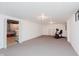 Spacious basement with carpeting and white walls ready for customization at 7135 Huntington Rd, Indianapolis, IN 46240