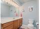 Bright bathroom with vanity, ample counter space, and neutral tiling at 7135 Huntington Rd, Indianapolis, IN 46240