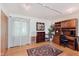 Bedroom with hardwood floors, natural light, a work station and ample built-in storage at 7135 Huntington Rd, Indianapolis, IN 46240