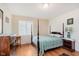 Traditional bedroom with four poster bed, neutral paint, and hardwood floors at 7135 Huntington Rd, Indianapolis, IN 46240