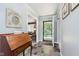 Welcoming entryway with slate floors, wood desk, and convenient coat closet at 7135 Huntington Rd, Indianapolis, IN 46240