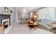 Cozy living room featuring a fireplace and neutral decor at 7135 Huntington Rd, Indianapolis, IN 46240