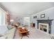 Inviting living room with fireplace, plush seating, and natural light at 7135 Huntington Rd, Indianapolis, IN 46240
