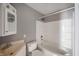 Well-lit bathroom featuring a shower-tub combination and classic fixtures, providing a clean and functional space at 732 S Biltmore Ave, Indianapolis, IN 46241