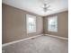 Sunny bedroom featuring neutral paint and plush carpeting, offering a calm and inviting atmosphere at 732 S Biltmore Ave, Indianapolis, IN 46241