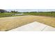 Lush backyard with a view of a serene pond featuring a fountain, enhancing the outdoor experience at 7323 Waylon Way, Indianapolis, IN 46239