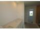 Bathroom with a dual sink vanity and a doorway, awaiting final touches at 7323 Waylon Way, Indianapolis, IN 46239