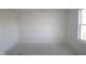 Spacious room with fresh white walls and a window, waiting for your personal design at 7323 Waylon Way, Indianapolis, IN 46239