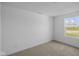 Bright bedroom with neutral carpet and natural light from the window at 7323 Waylon Way, Indianapolis, IN 46239