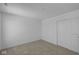 Neutral carpeted bedroom features closet with sliding doors and fresh white trim at 7323 Waylon Way, Indianapolis, IN 46239