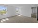 Bright bedroom with views of green spaces, neutral carpet, and natural light at 7323 Waylon Way, Indianapolis, IN 46239