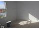 Bright bedroom featuring a large window with a view and freshly painted white walls at 7323 Waylon Way, Indianapolis, IN 46239