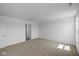 Spacious bedroom featuring plush carpet, a doorway, and a bright window view at 7323 Waylon Way, Indianapolis, IN 46239