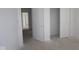 Hallway with fresh white doors and trim, leading to various rooms at 7323 Waylon Way, Indianapolis, IN 46239