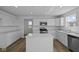 Bright kitchen featuring white cabinets, stainless steel appliances, and an island at 7323 Waylon Way, Indianapolis, IN 46239