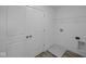 Laundry room featuring tile flooring, storage shelves and easy access for all your needs at 7323 Waylon Way, Indianapolis, IN 46239
