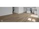 Spacious living area adjacent to the kitchen, featuring modern floors and ample natural light at 7323 Waylon Way, Indianapolis, IN 46239