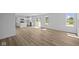 Open-concept living area featuring modern floors and an abundance of natural light at 7323 Waylon Way, Indianapolis, IN 46239