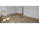 A light-filled room with modern flooring, closet space, and a large window at 7323 Waylon Way, Indianapolis, IN 46239