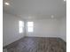 A well-lit bedroom features two windows and modern recessed lighting at 7329 Waylon Way, Indianapolis, IN 46239