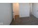 View into a bedroom with an open closet and bright carpeting at 7329 Waylon Way, Indianapolis, IN 46239