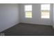 A naturally lit bedroom with a bright window showing neighborhood views at 7329 Waylon Way, Indianapolis, IN 46239