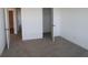 A neutral bedroom with carpeting featuring a view into an open closet space at 7329 Waylon Way, Indianapolis, IN 46239