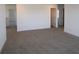 This carpeted bedroom features multiple entryways and neutral walls at 7329 Waylon Way, Indianapolis, IN 46239