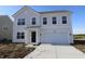 Charming two-story home features a two-car garage and a classic light gray exterior at 7329 Waylon Way, Indianapolis, IN 46239